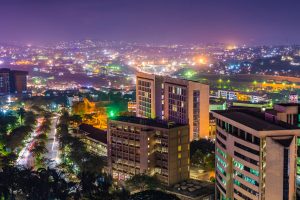 A stock photo of high rise buildings in Kampala, Uganda, at night