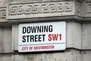 A stock image of a street sign which says Downing Street SW1