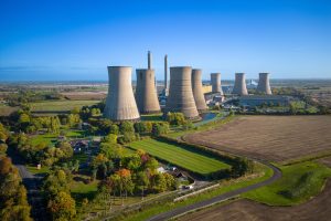 A stock photo of a nuclear power station under blue sky